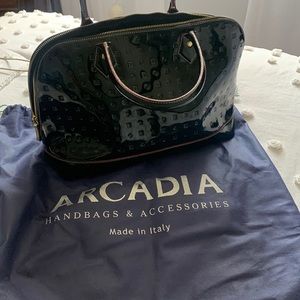 Arcadia signature embossed parent leather handbag